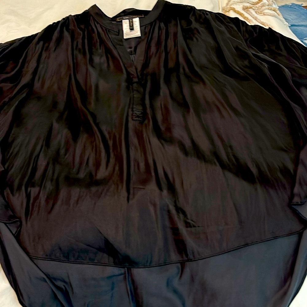 Blouse, satin material can be washed in cold water or dry cleaned